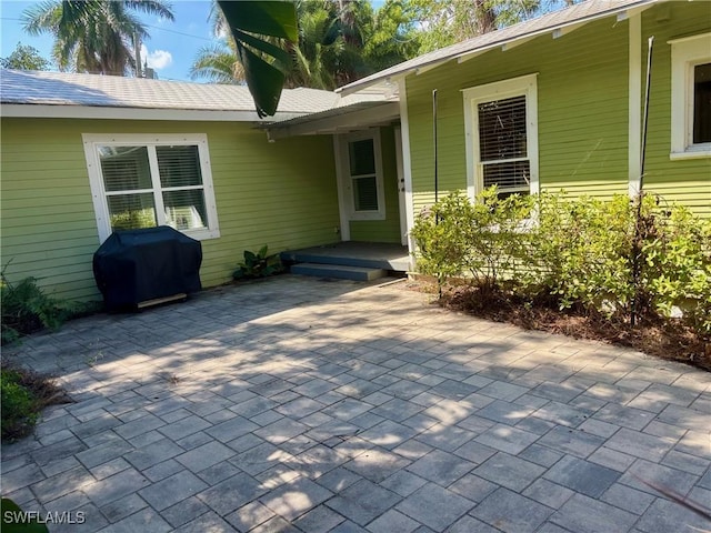 property entrance with a patio area