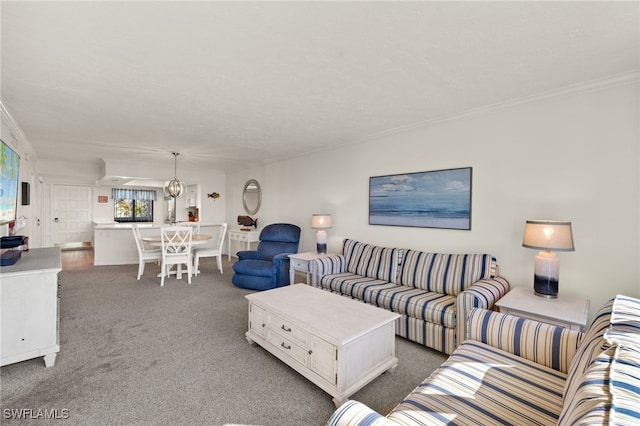 living room featuring ornamental molding and carpet floors