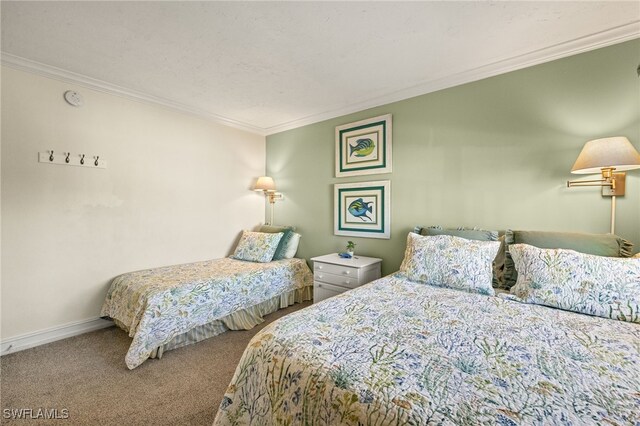 carpeted bedroom featuring crown molding