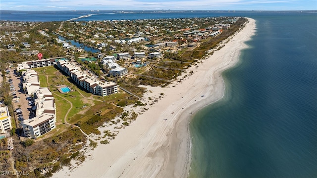 aerial view with a water view and a view of the beach