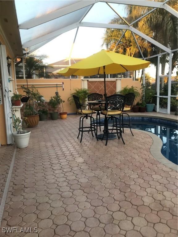 exterior space with a lanai and a patio area