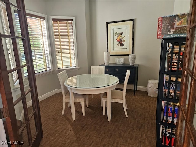 dining room with dark parquet floors