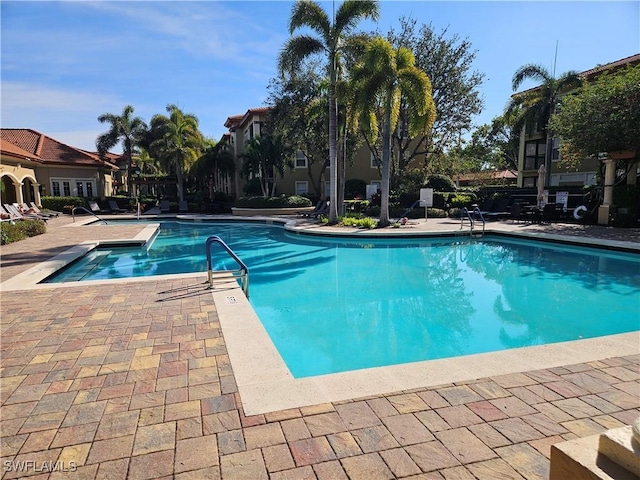 view of swimming pool featuring a patio