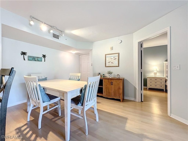 dining room featuring light hardwood / wood-style flooring