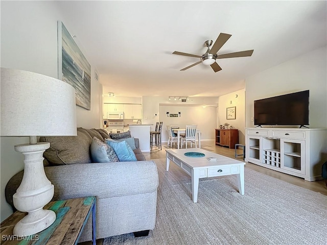 living room with ceiling fan