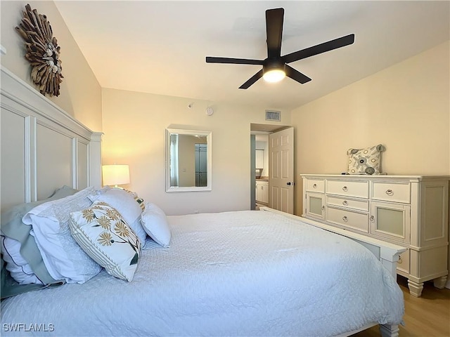 bedroom with wood-type flooring and ceiling fan