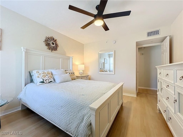 bedroom with ceiling fan and light hardwood / wood-style floors