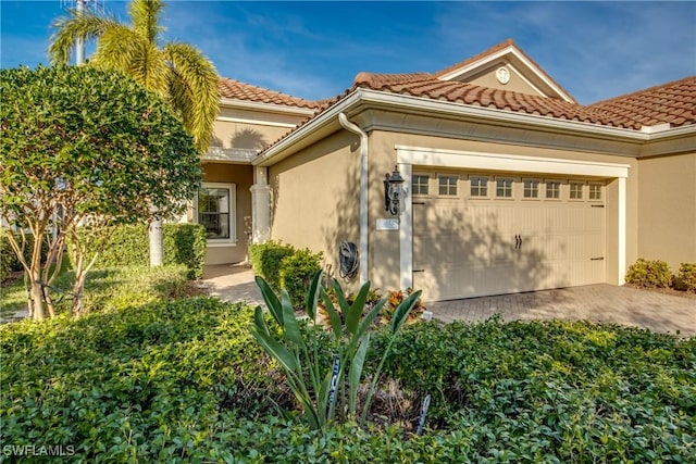 mediterranean / spanish-style house featuring a garage