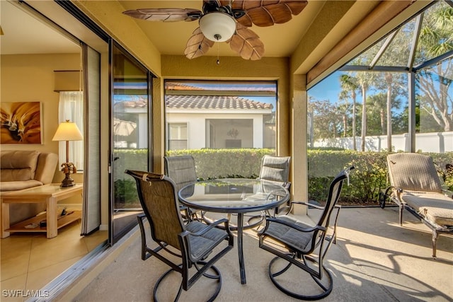 sunroom featuring ceiling fan