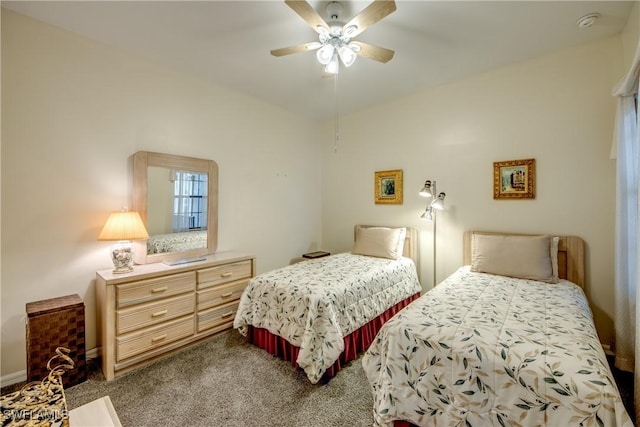 bedroom with ceiling fan, lofted ceiling, and carpet flooring