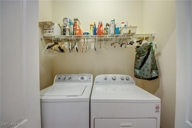 washroom featuring washing machine and dryer