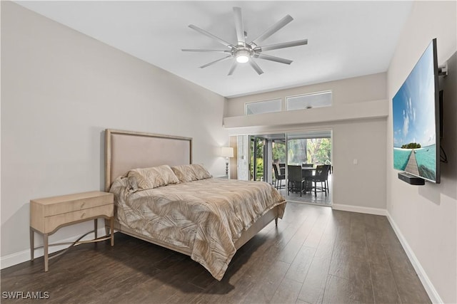 bedroom featuring access to outside, dark hardwood / wood-style floors, and ceiling fan