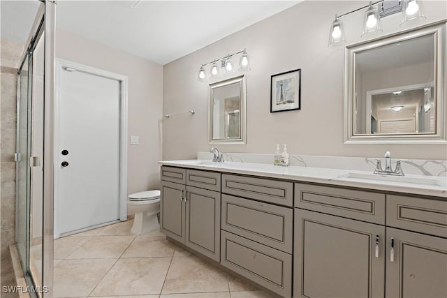 16648 Bobcat Ct, Fort Myers, FL 33908 - full bath with a stall shower, toilet, double vanity, and tile patterned flooring