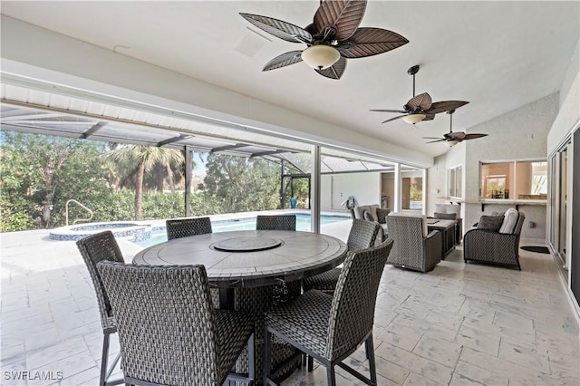 sunroom / solarium featuring vaulted ceiling and ceiling fan