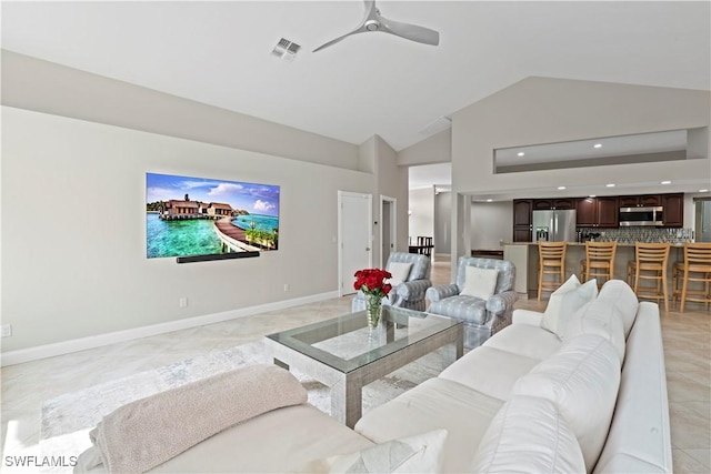 living room featuring vaulted ceiling, ceiling fan, and light tile patterned flooring