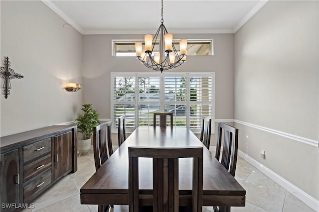 tiled dining room featuring ornamental molding and an inviting chandelier