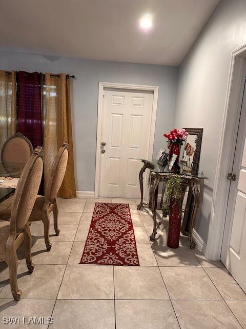 foyer featuring light tile patterned flooring