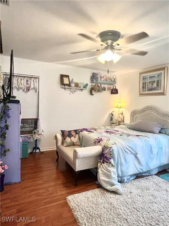 bedroom featuring dark wood-type flooring and ceiling fan