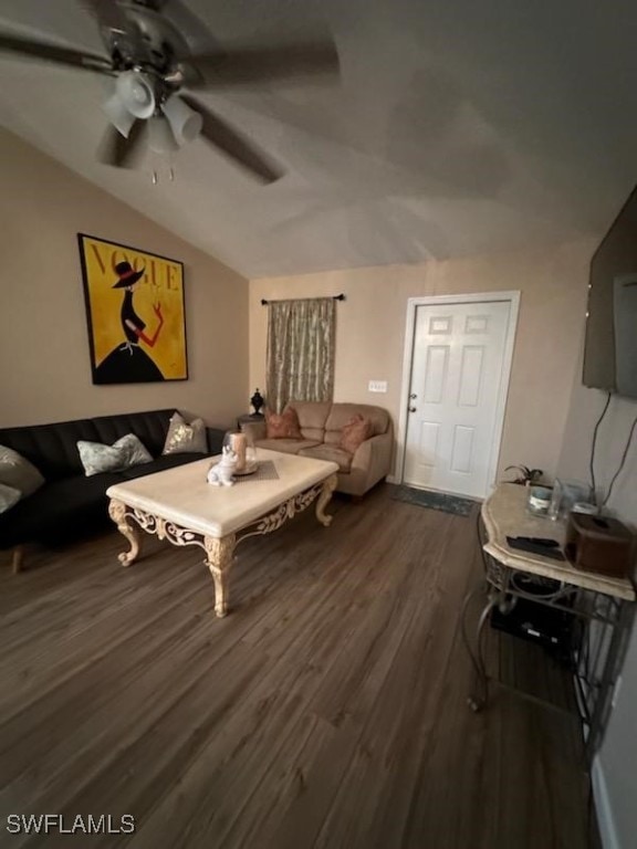 living room with lofted ceiling, dark hardwood / wood-style floors, and ceiling fan