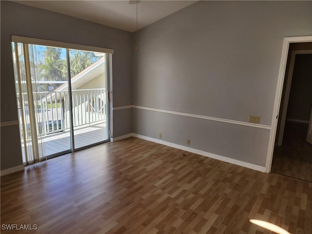 empty room featuring dark wood-type flooring