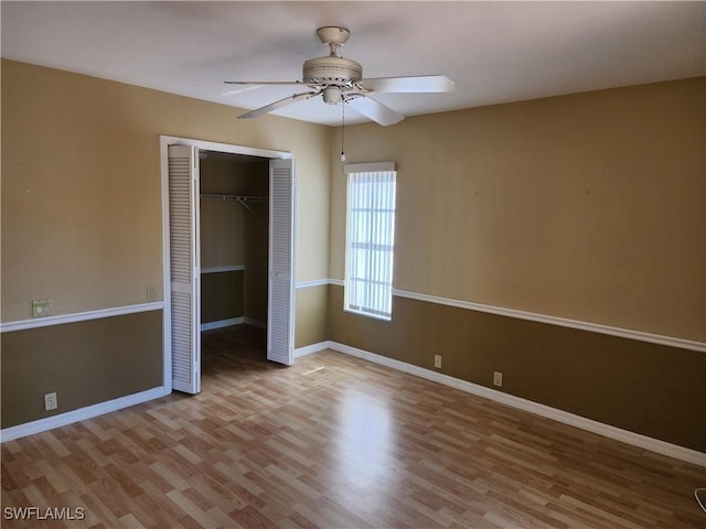 unfurnished bedroom featuring a closet, ceiling fan, and light wood-type flooring