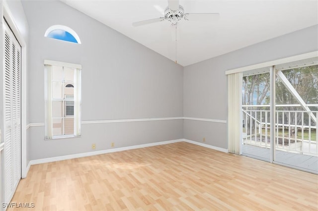 empty room with baseboards, ceiling fan, and light wood-style floors