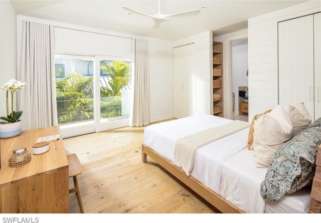 bedroom with access to outside and light hardwood / wood-style floors