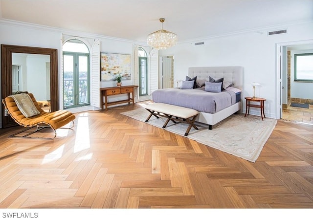 bedroom with a notable chandelier, crown molding, french doors, and light parquet floors