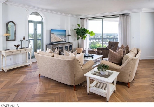 living room featuring crown molding, plenty of natural light, and dark parquet floors