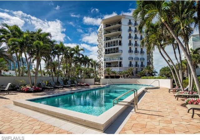 view of swimming pool with a patio