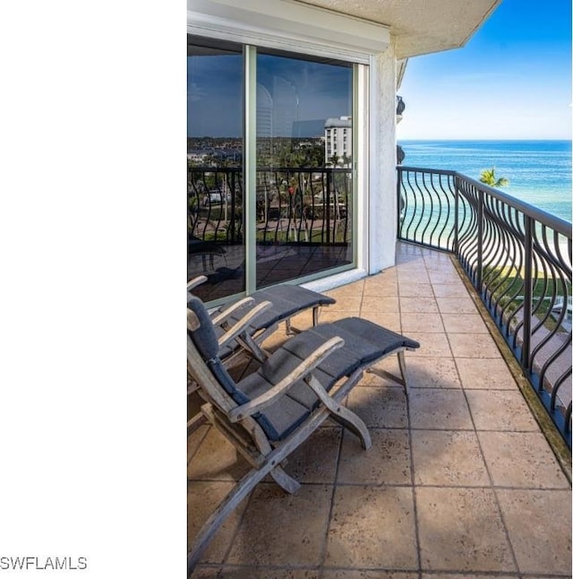 balcony featuring a water view