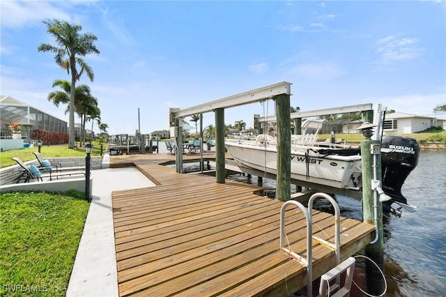 view of dock with boat lift and a water view