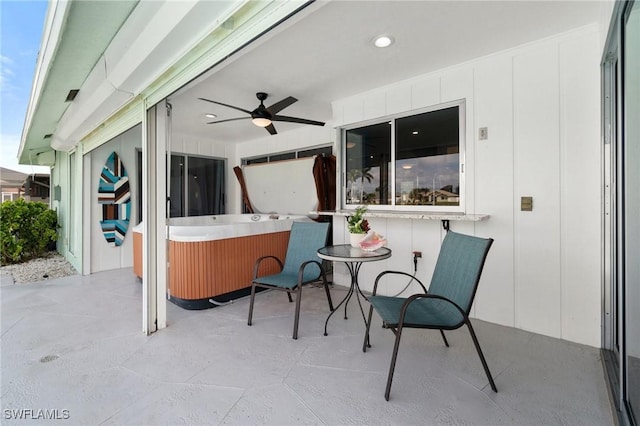 view of patio / terrace with a hot tub and ceiling fan
