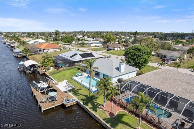 aerial view with a residential view and a water view