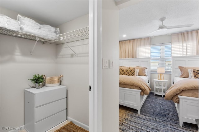 spacious closet with ceiling fan