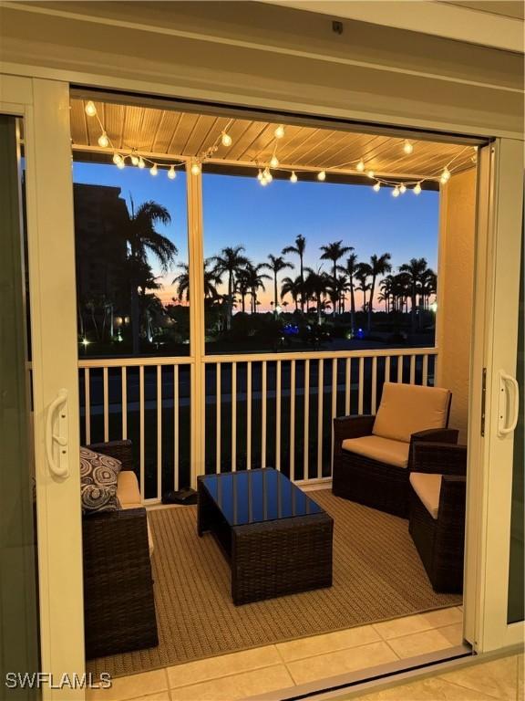 deck at dusk featuring an outdoor hangout area