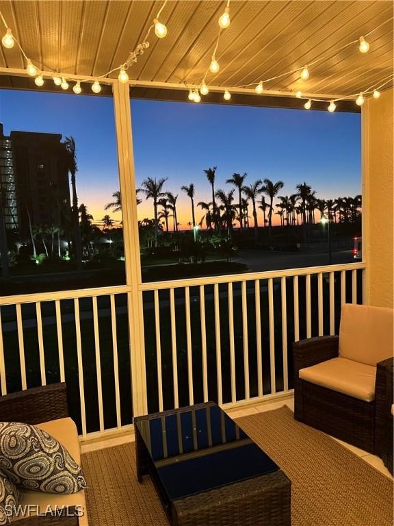 deck at dusk featuring an outdoor living space