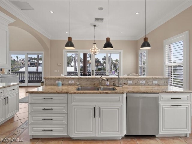 kitchen featuring pendant lighting, sink, white cabinets, stainless steel dishwasher, and light stone counters