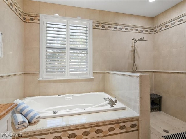 bathroom featuring vanity, shower with separate bathtub, tile patterned flooring, and tile walls