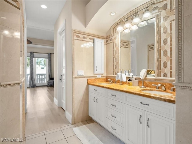 bathroom featuring tile patterned flooring and vanity