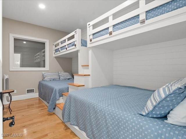 bedroom with wood-type flooring