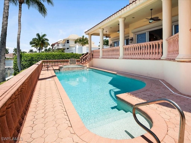 view of pool featuring an in ground hot tub and ceiling fan