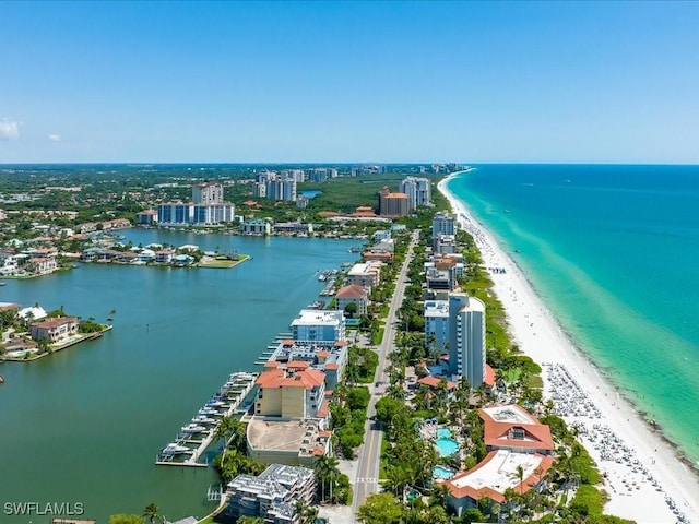 bird's eye view featuring a water view and a view of the beach