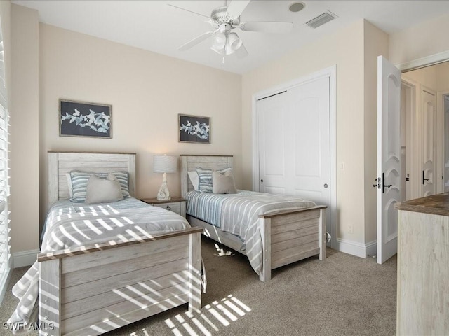 carpeted bedroom featuring ceiling fan