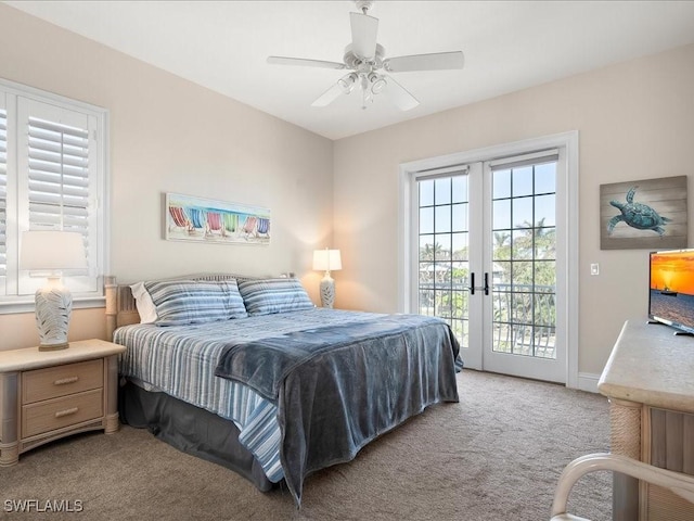 carpeted bedroom with access to exterior, ceiling fan, and french doors