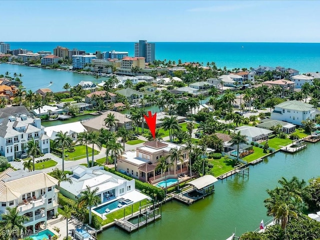 birds eye view of property with a water view