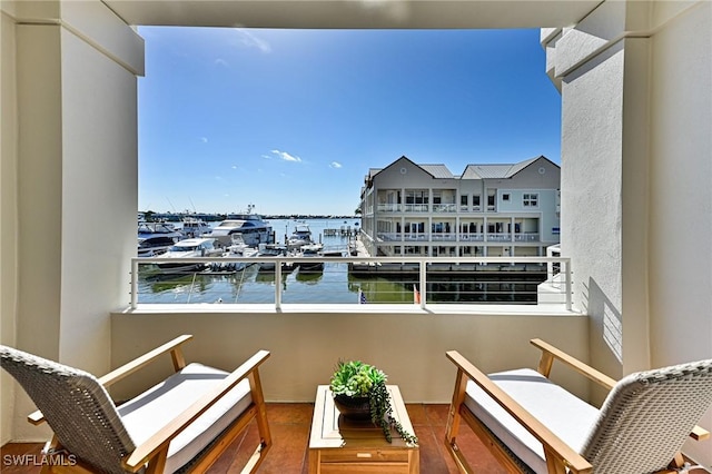 balcony featuring a water view