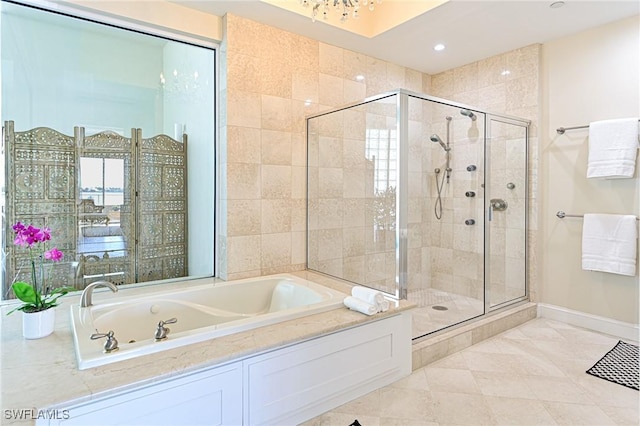 bathroom featuring tile patterned flooring and plus walk in shower