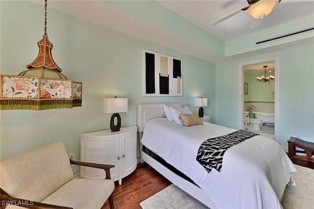 bedroom featuring ceiling fan, dark hardwood / wood-style floors, and ensuite bath