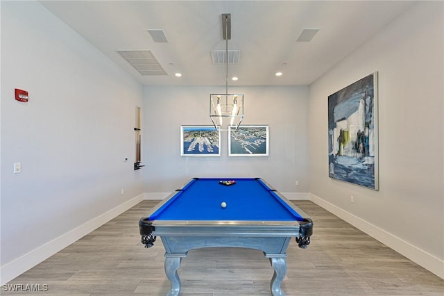 recreation room with billiards and light hardwood / wood-style flooring